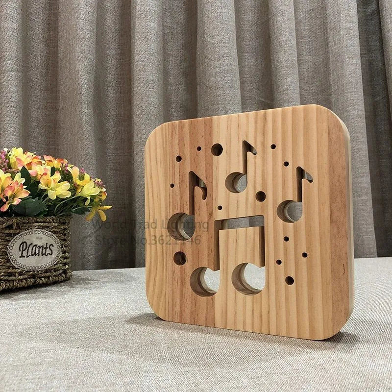 Square pine wood LED atmosphere lamp with warm white 3D illumination showing USB cable connection