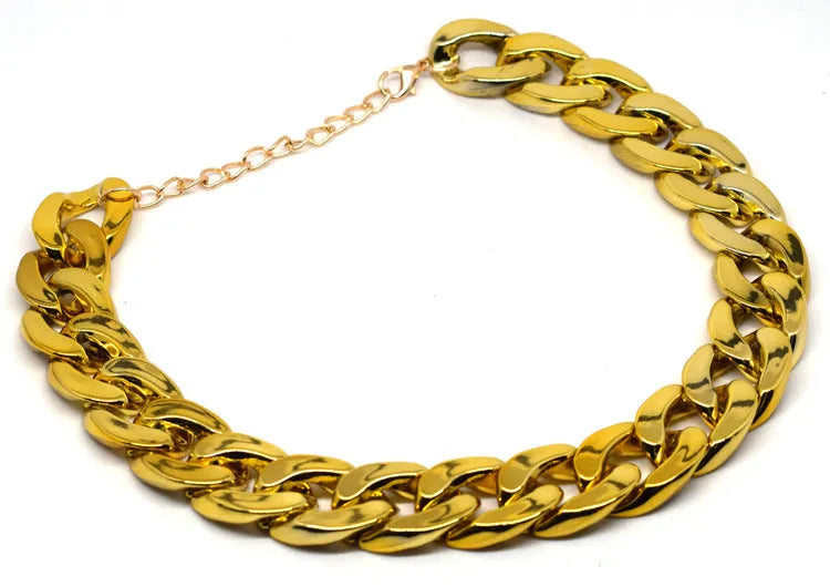 Gold coloured chain dog collar with twisted geometric pattern and buckle on small dog
