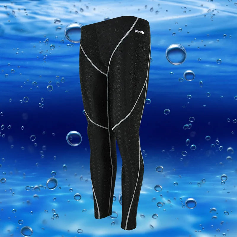 Men's black nylon cropped swimming trunks with green line detail for swimming and sports