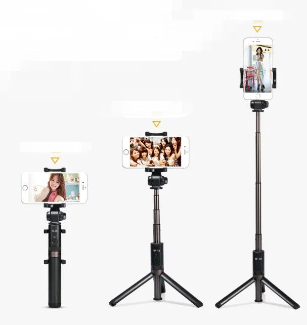 Aluminium Bluetooth selfie stick with tripod legs extended and wireless remote on a table