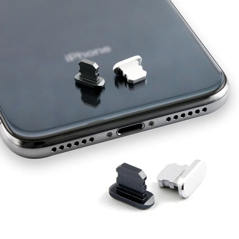 Aluminium alloy dust plug for iPhone charging port in various colours including gold, silver, blue, and rose gold.