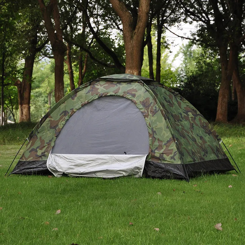 Green digital camouflage outdoor tent with fibreglass poles setup in woodland environment