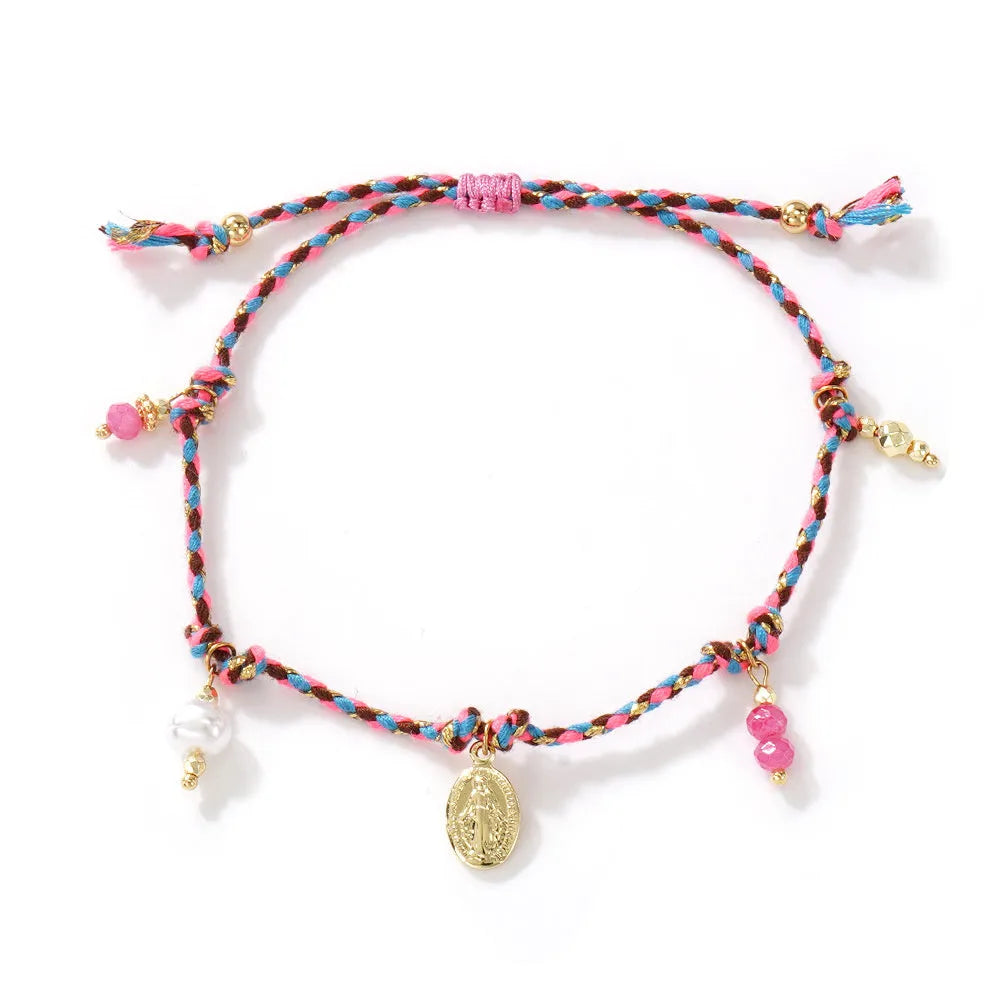 Close-up of a hand-woven colourful braided rope bracelet for women, showing textured ethnic style.