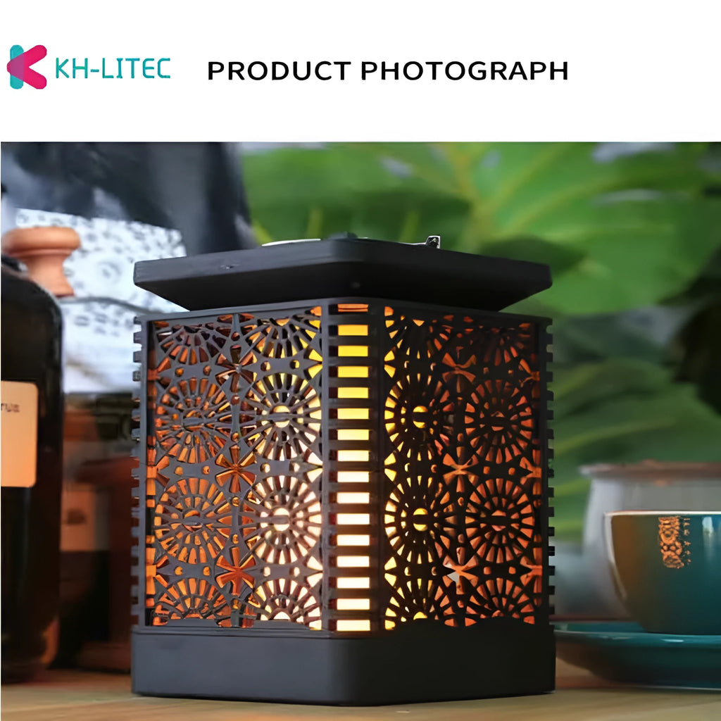 Black solar hanging flame torch LED light for outdoor garden and patio decoration.
