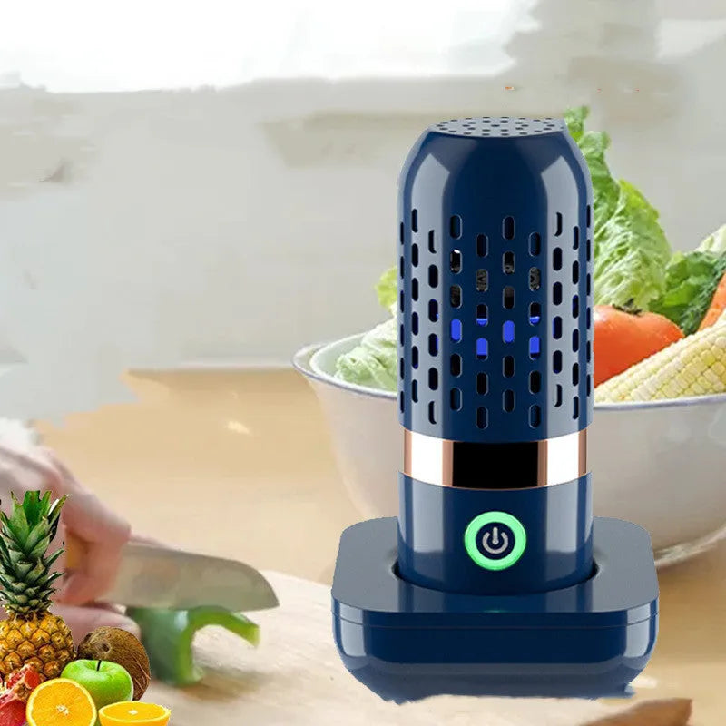 Blue capsule fruit and vegetable purifier with mechanical button and USB charging, placed in water