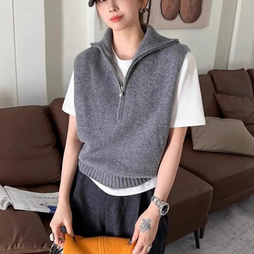 Orange retro half zip sleeveless mesh knit vest with 3D pattern showing front view