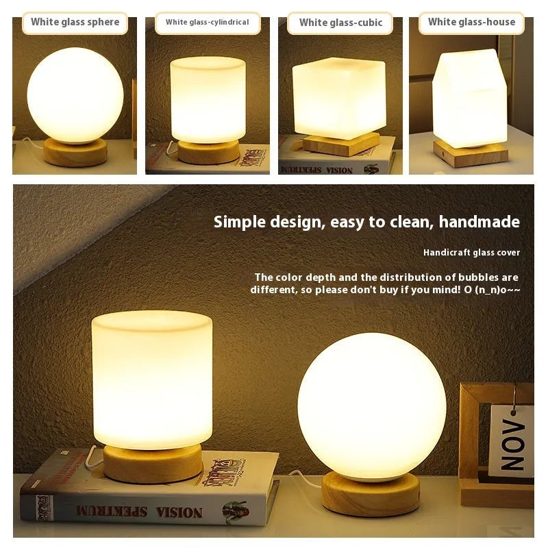 Nordic solid wood base USB table lamp with a white geometric shade on a wooden table.