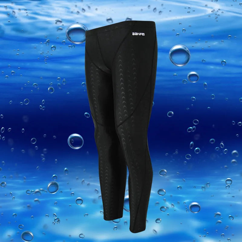 Men's black nylon cropped swimming trunks with green line detail for swimming and sports