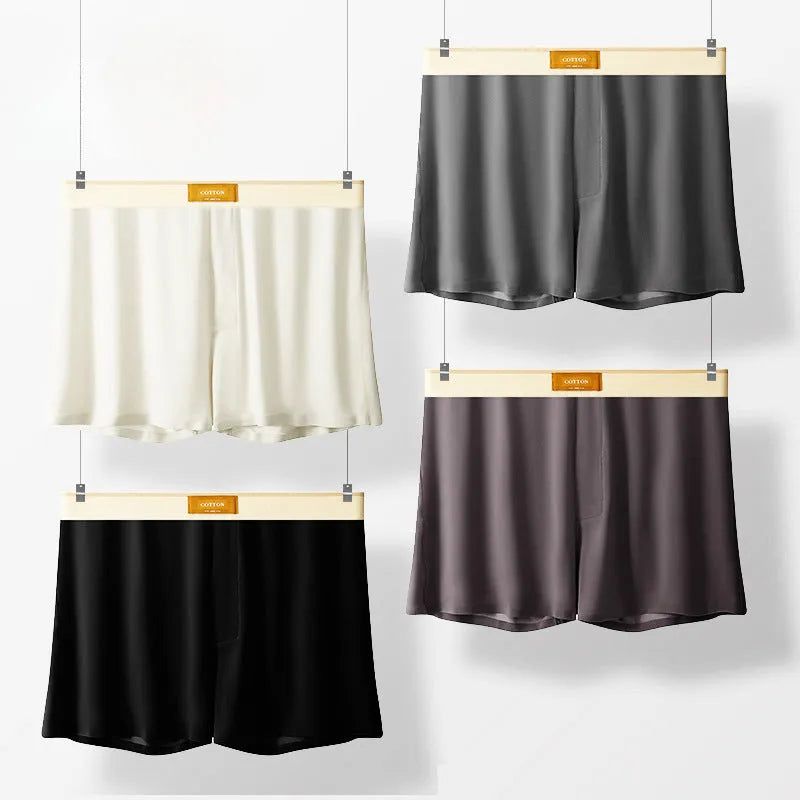 Men's solid colour loose ice silk underwear in a pack of three, shown in beige, black, and grey.
