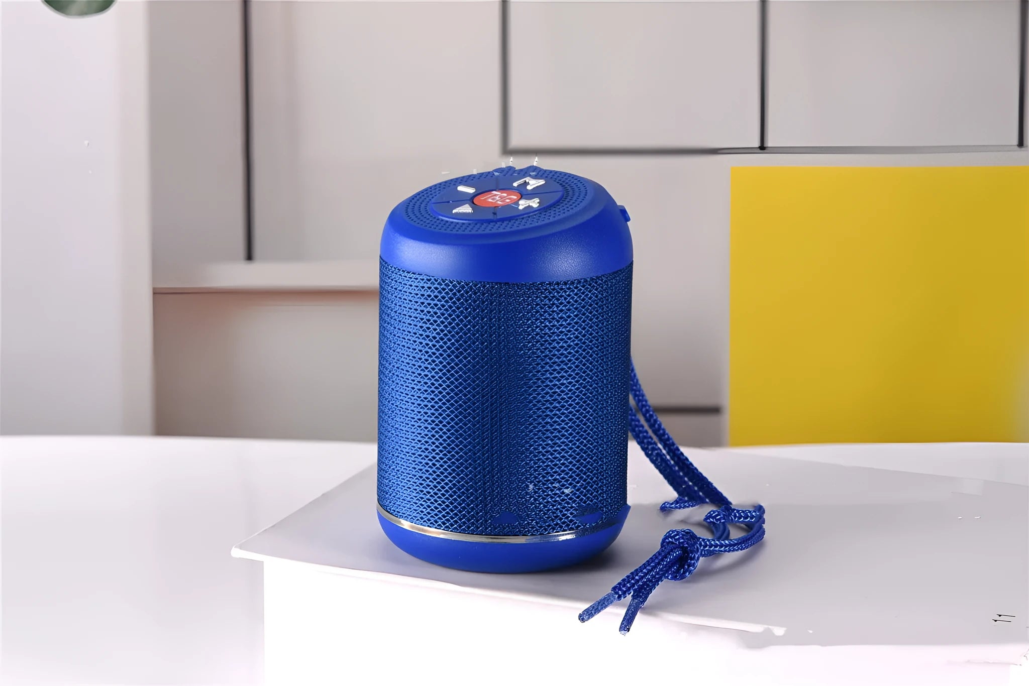 Portable outdoor Bluetooth subwoofer in multiple colours showing button controls for radio and playback functions.