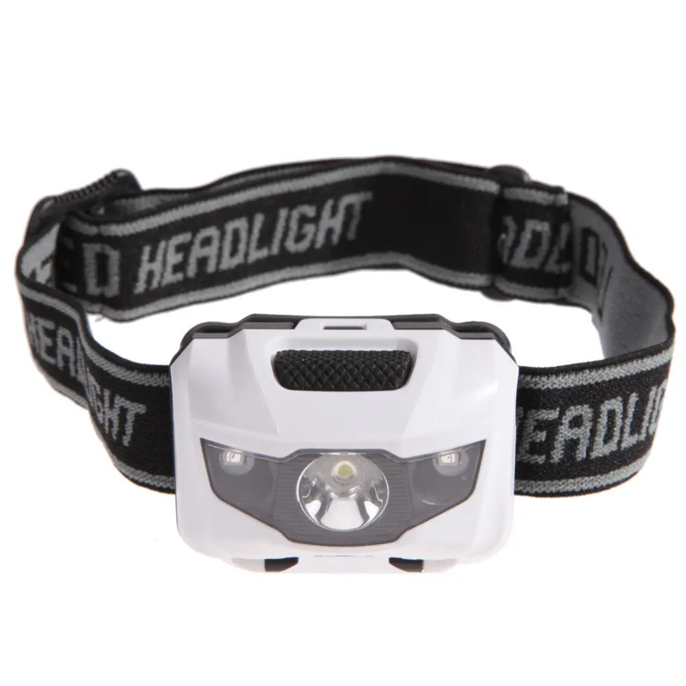A black waterproof head torch with a central white LED and two smaller red LEDs, mounted on an adjustable headband.