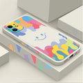 White silicone iPhone case with rainbow smiley face design and attached lanyard
