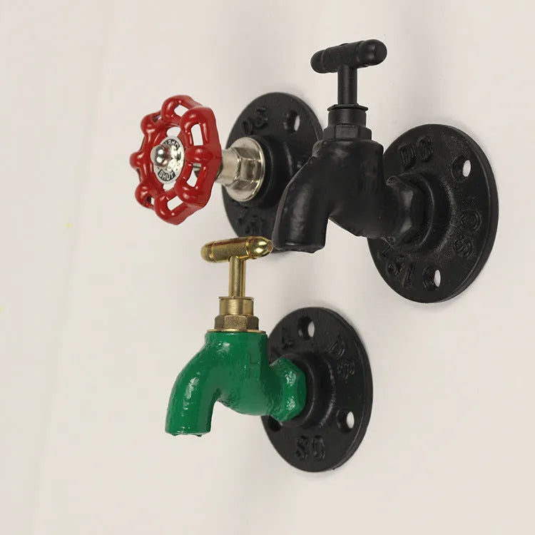 Water pipe style metal towel rack hook mounted on wall with towels hanging