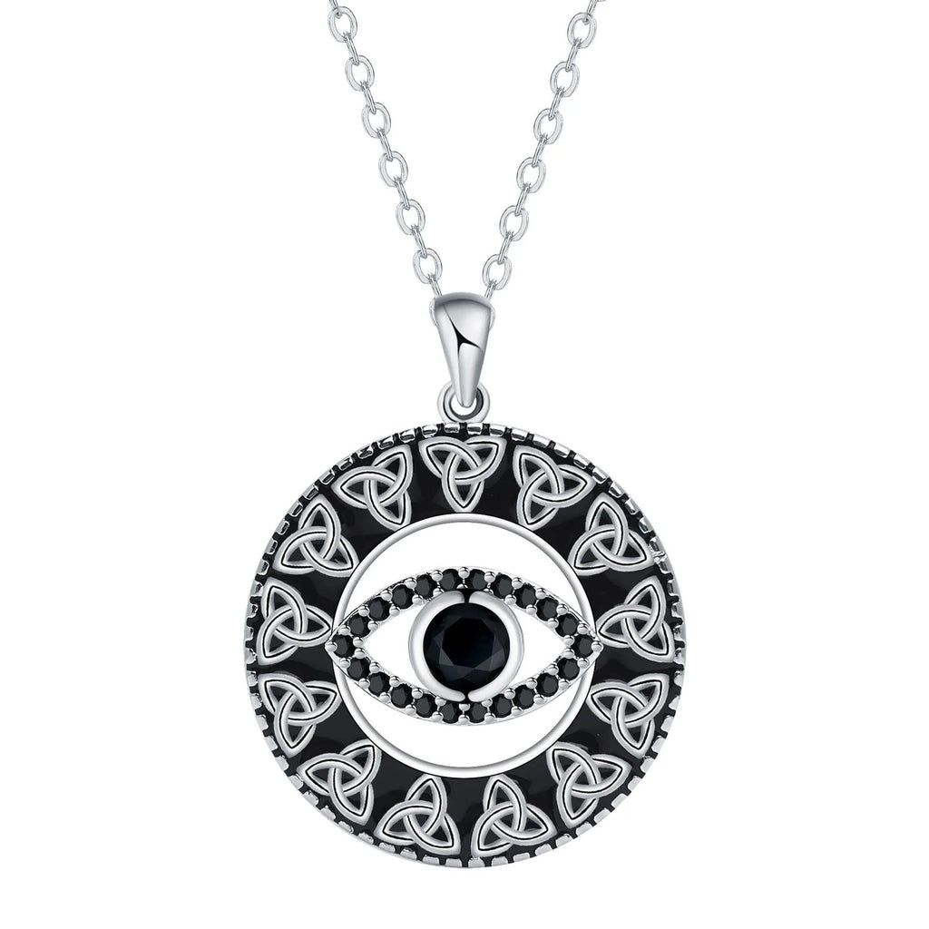 Close-up of a copper Devil's Eye pendant necklace with an electroplated finish on a matching cross chain.