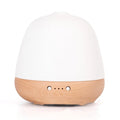 White ceramic ultrasonic essential oil humidifier with 180ml capacity on a table top