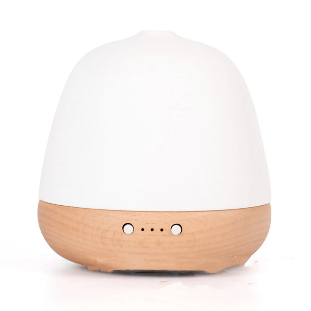 White ceramic ultrasonic essential oil humidifier with 180ml capacity on a table top