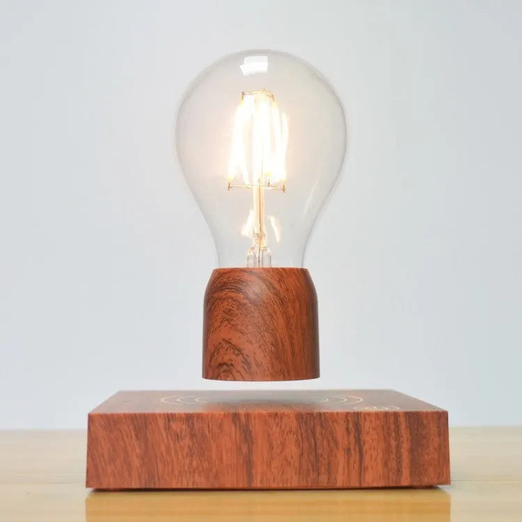 Magnetic levitation floating bulb lamp with imitation wood base and glass construction