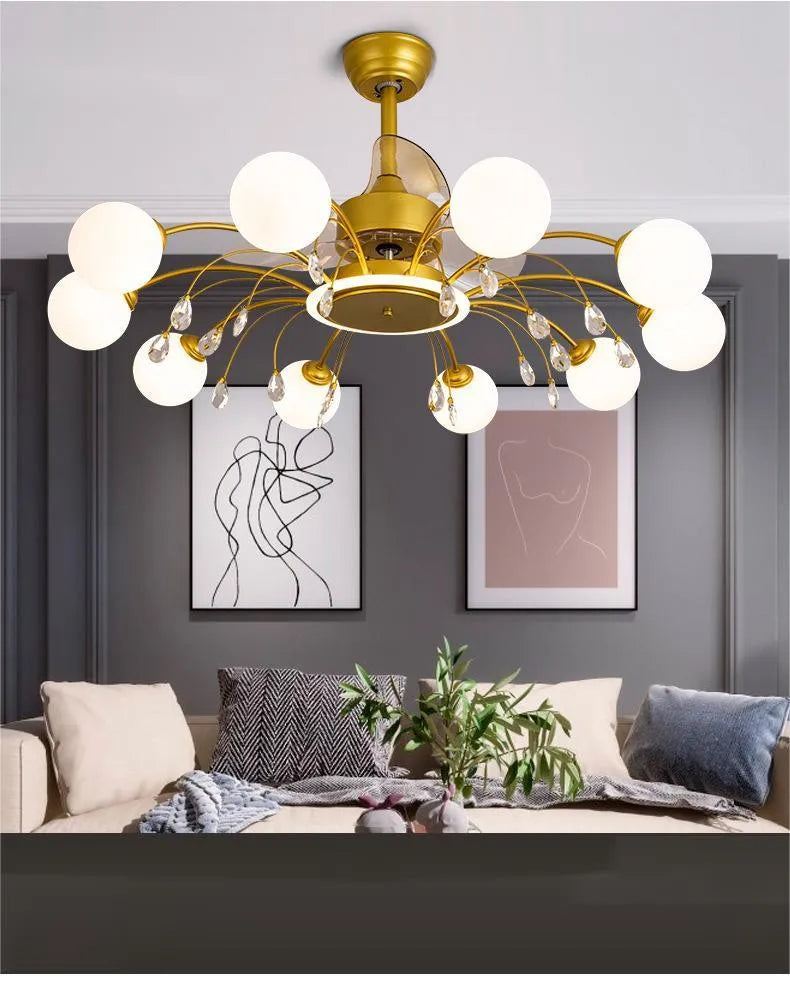 Gold and black ceiling fan lamp with acrylic shade and metal blades, showing remote control