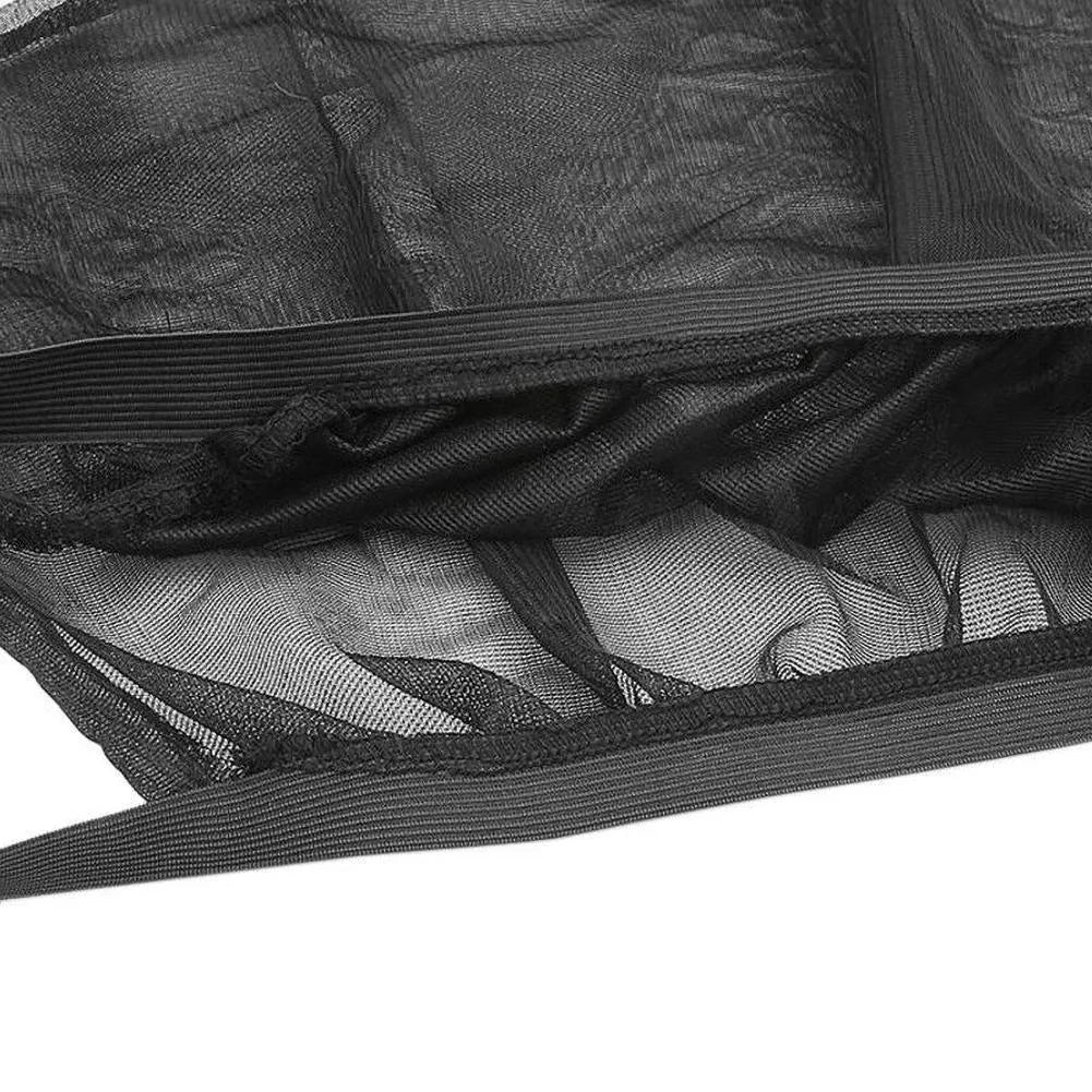 Set of grey non-woven fabric car side window sunshades with elastic edges on a car window.