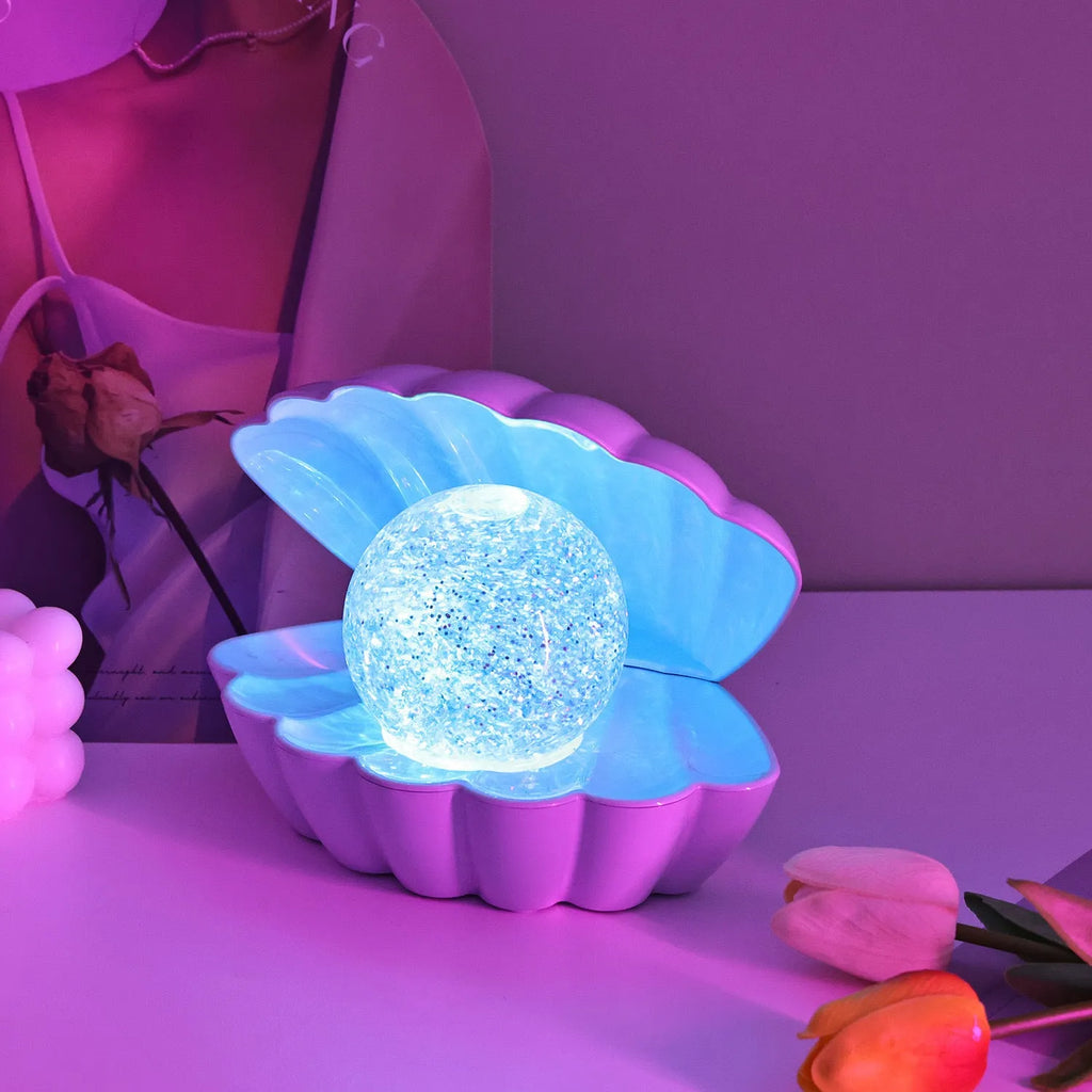 Shell-shaped small neon night lamp with battery power for ambience lighting.