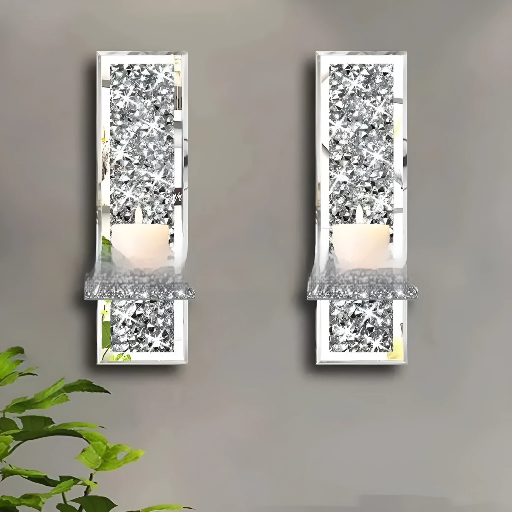 Pair of tall, silver mirror glass candlesticks designed for wall mounting in a living room.
