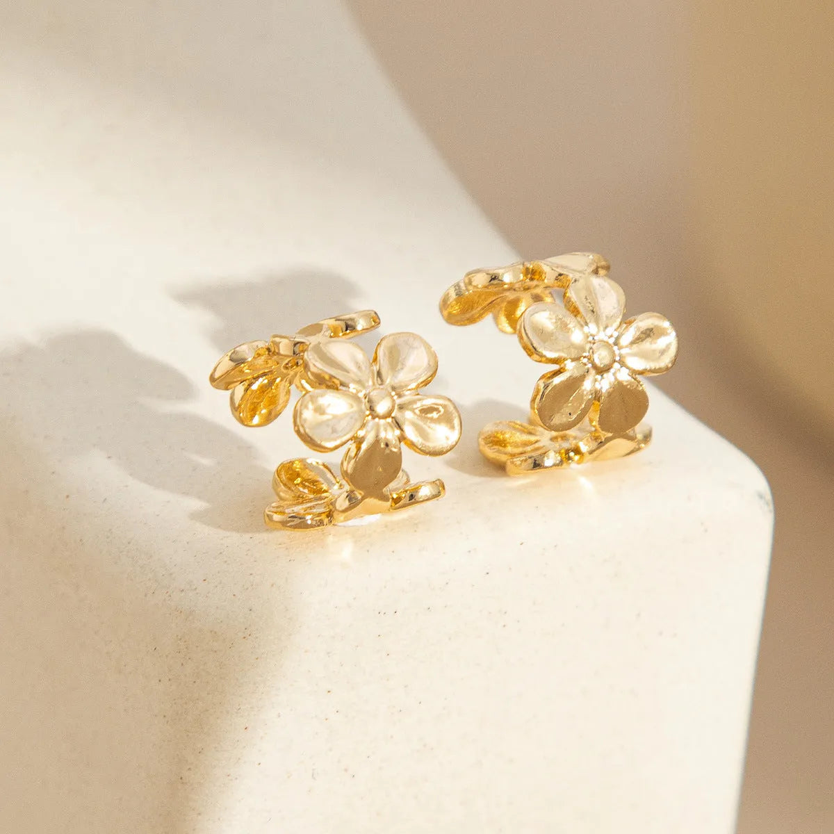 Gold electroplated women's earrings with starfish and scallop shell designs