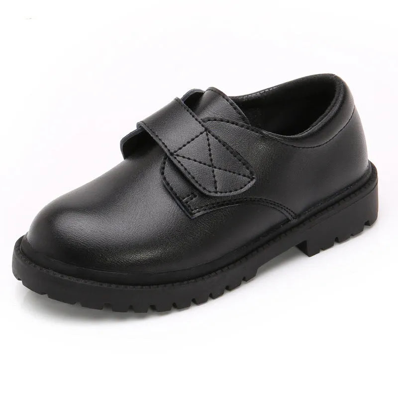 School designated black dance shoes with rubber sole and low top design for children