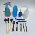 Succulent gardening tool set showing mini shovels, tweezers, watering can, brush and rake for small plant care