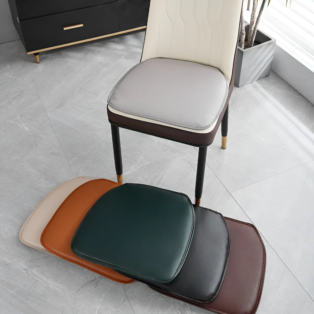 Leather horseshoe-shaped seat cushion in beige colour on a wooden chair, showing non-slip base.