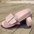 Women's grey blue buckle flip flops with a soft EVA sole on a plain background