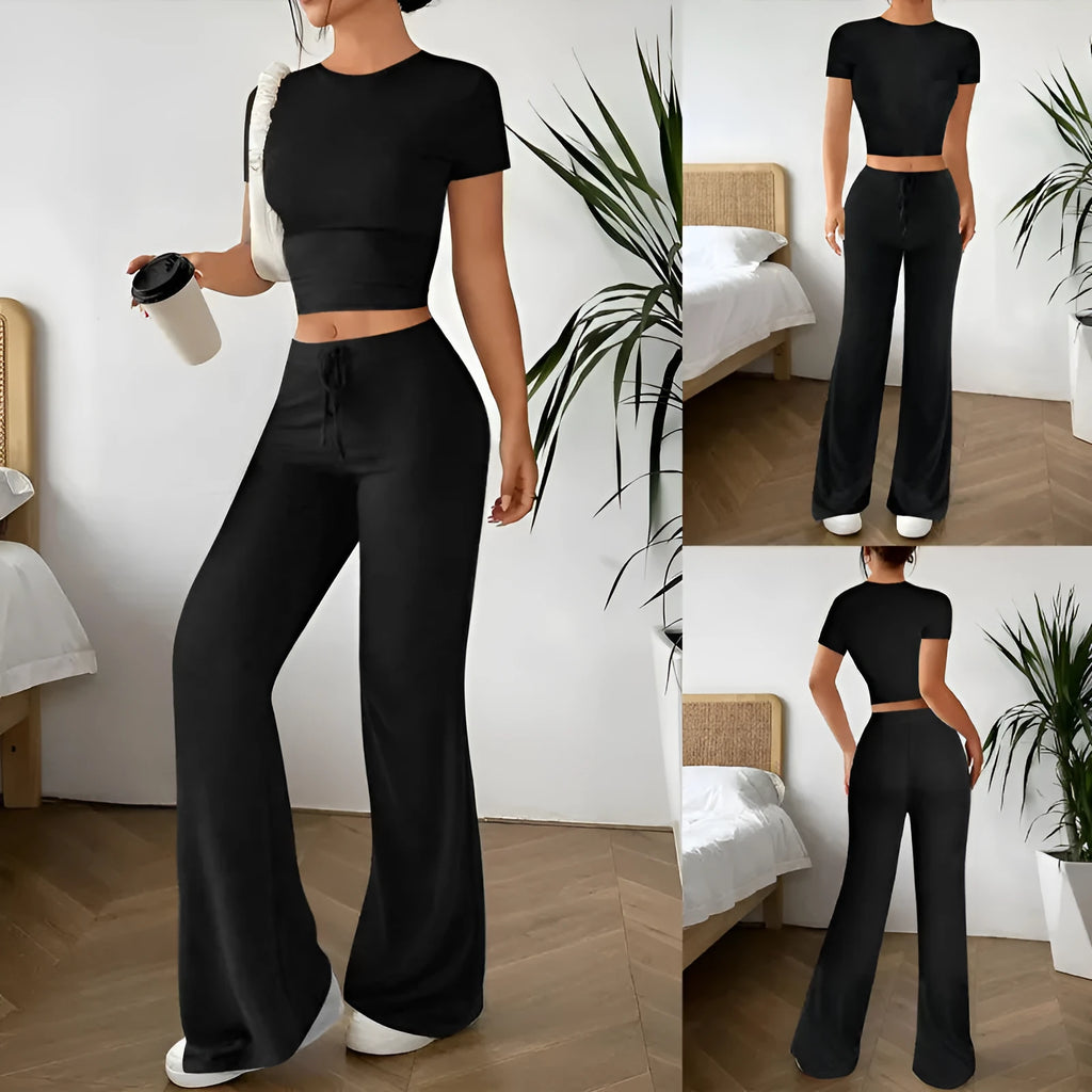 Black women's co-ord suit with high-waist trousers and a short-sleeve T-shirt on a hanger.