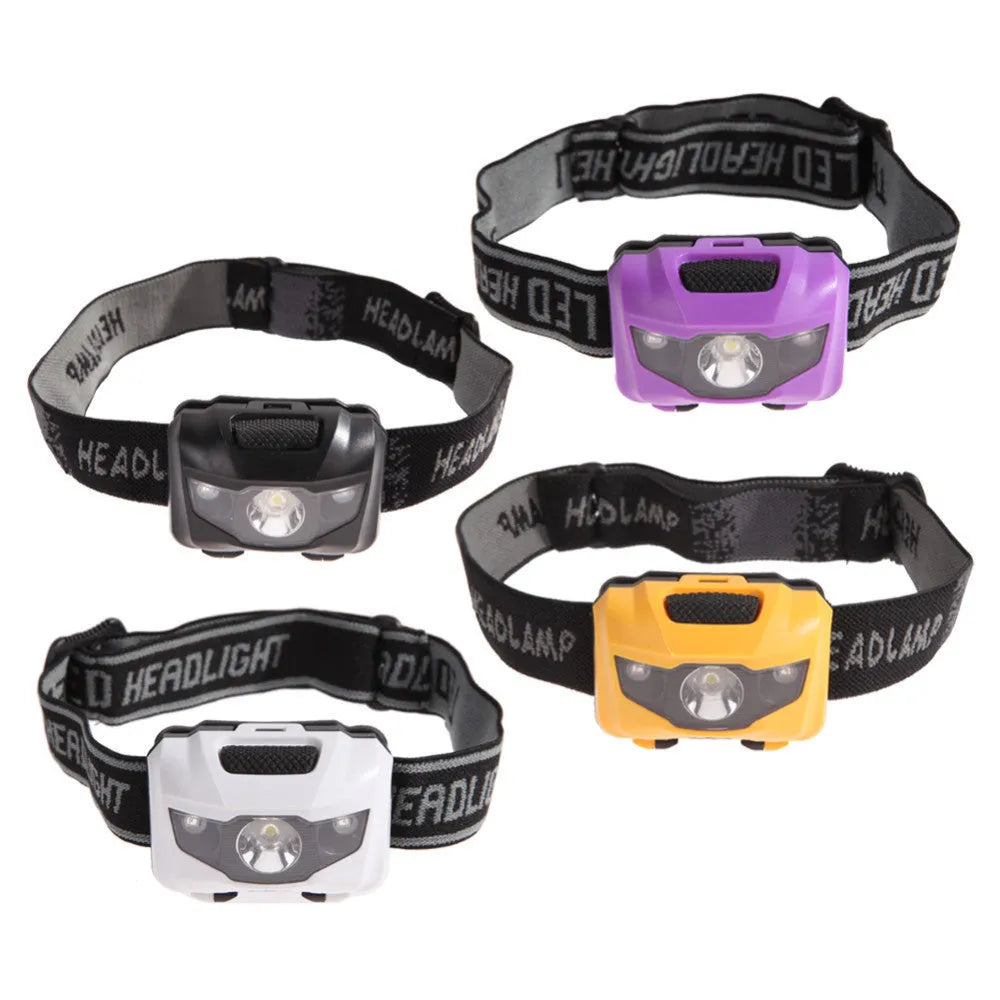 A black waterproof head torch with a central white LED and two smaller red LEDs, mounted on an adjustable headband.