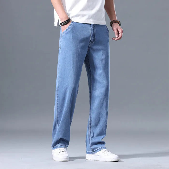 Men's loose straight-leg lyocell jeans in light blue, blue grey, smoky grey, and retro blue colours with zipper fly