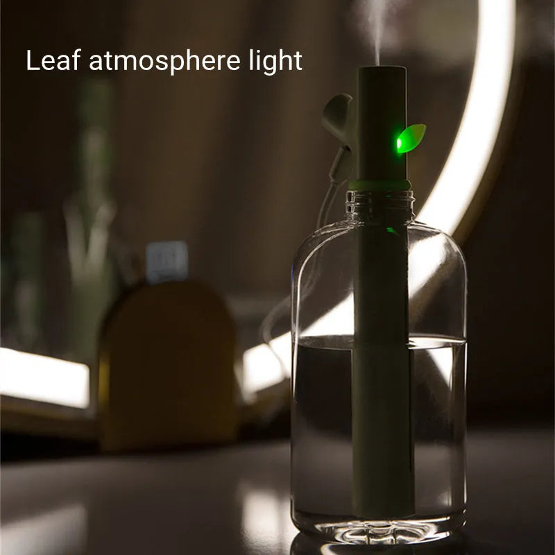 Transparent plastic USB portable humidifier with water tank on desk