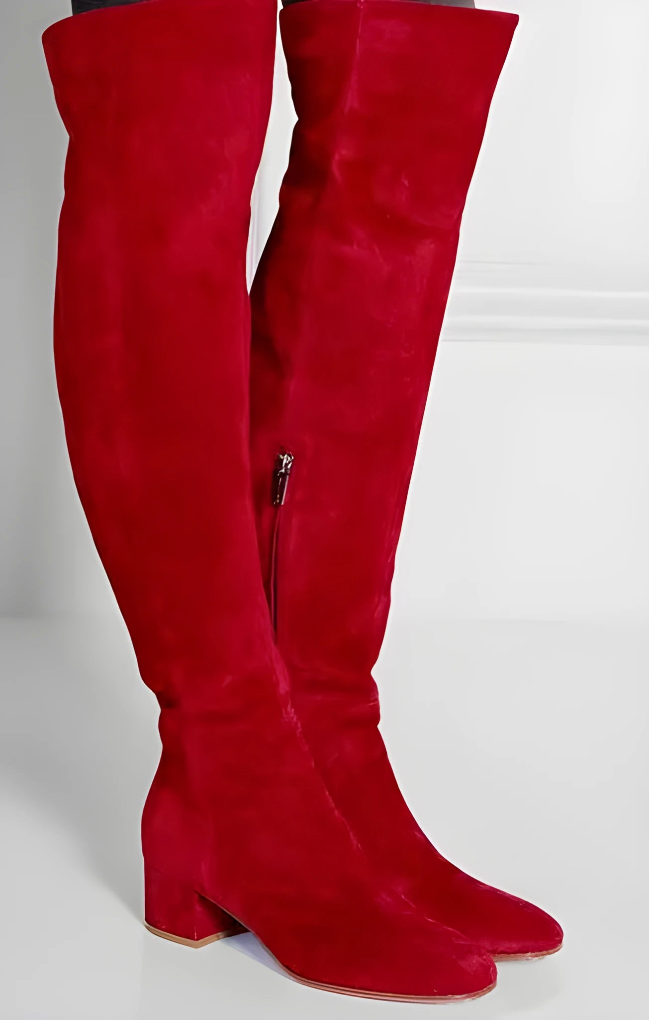 Grey suede women's over the knee flat boots with a pointed toe and thick low heel.