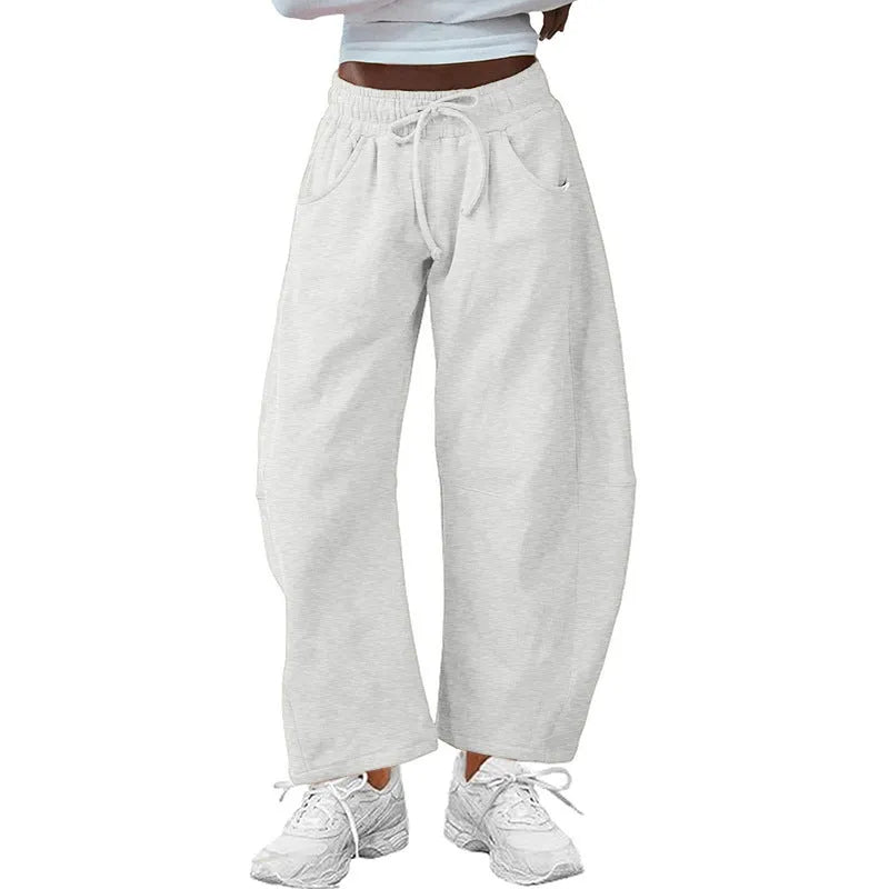 Women's loose cropped sweatpants with drawstring elastic waist and side pockets in street fashion style