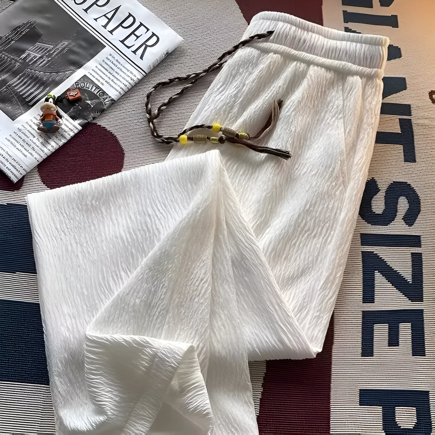 Men's thin loose straight trousers with Korean style folding craft in black and white options