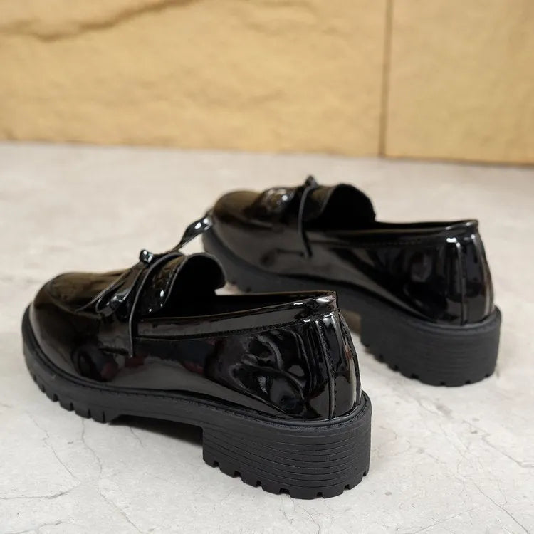 Brown women's flat loafers with a decorative bow and elastic slingback.