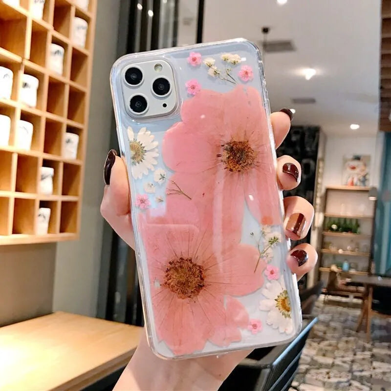 Pink and yellow floral print TPU back cover case for iPhone on a white background.