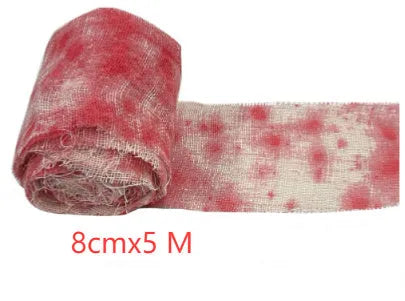 Roll of Halloween horror bandage in bloody red colour with a frayed end, showing its 8cm width and cloth-like polyester texture.