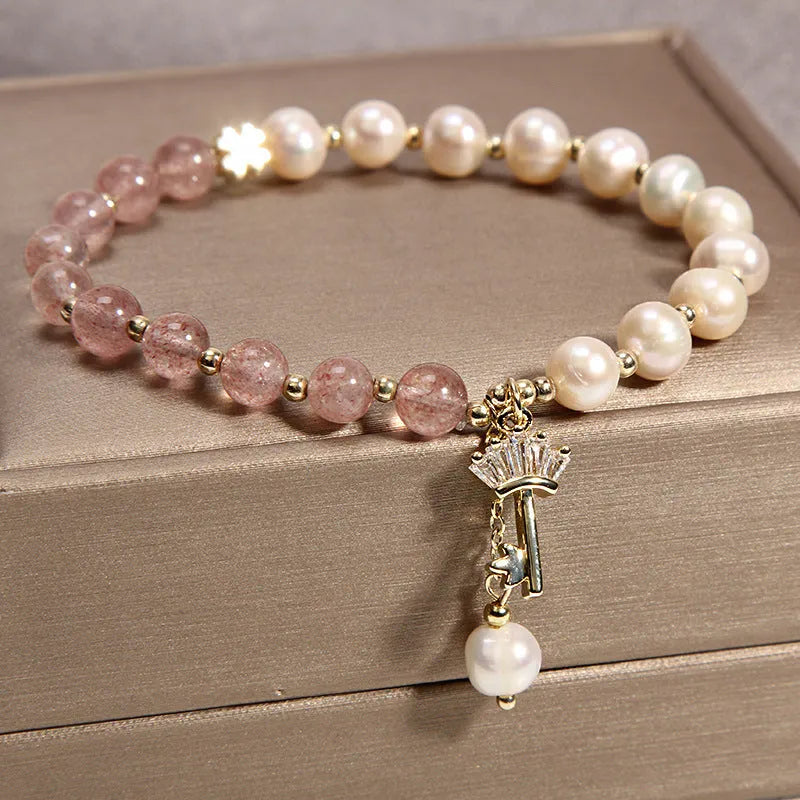 Natural garnet multi-layer crystal bracelet with strawberry quartz, moonstone, and pendant details in Korean light luxury style