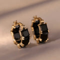 Gold-plated geometric ear ring with U-shaped design and round elements
