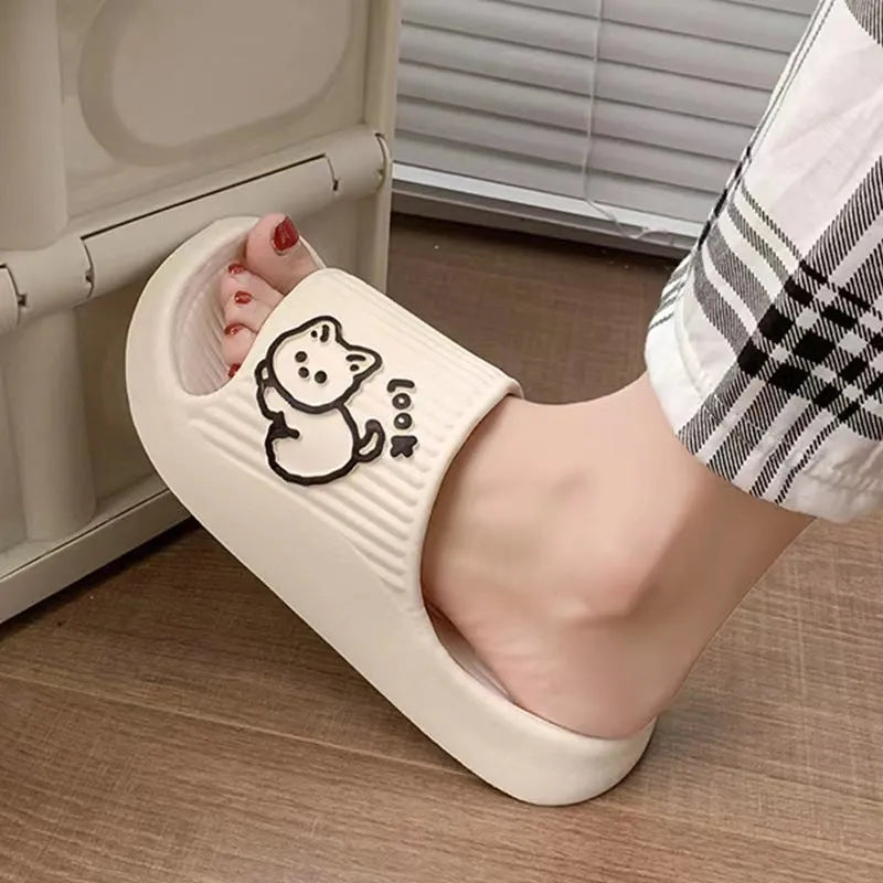 Women's pink cat-themed flip-flop slippers with a thick light blue EVA platform sole.