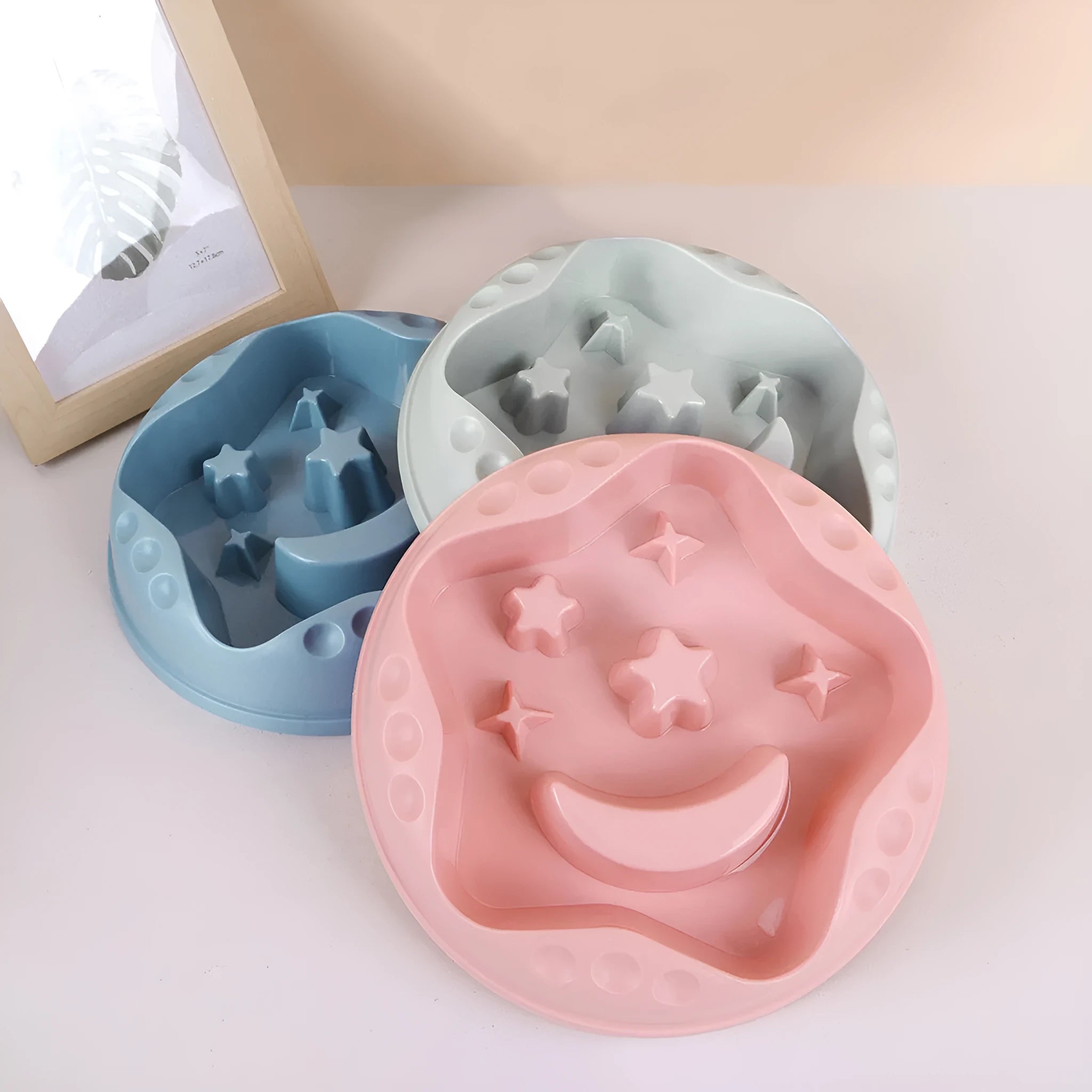 Moon Star Wings slow feeder dog bowl in blue colour with raised obstacles and anti-slip base.
