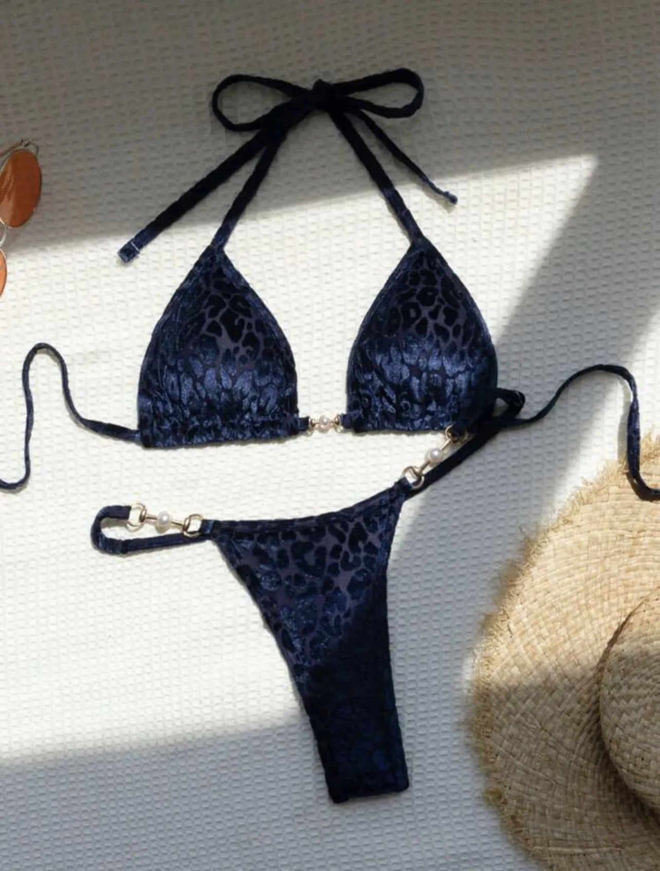 Blue leopard print T-shaped women's bikini swimsuit set on a mannequin.