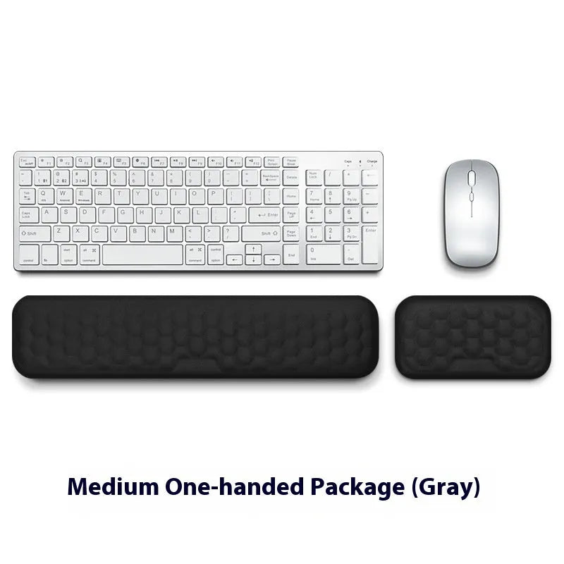Grey and black memory foam mouse wrist pads with silicone bases, shown in cloth and leather cover options.