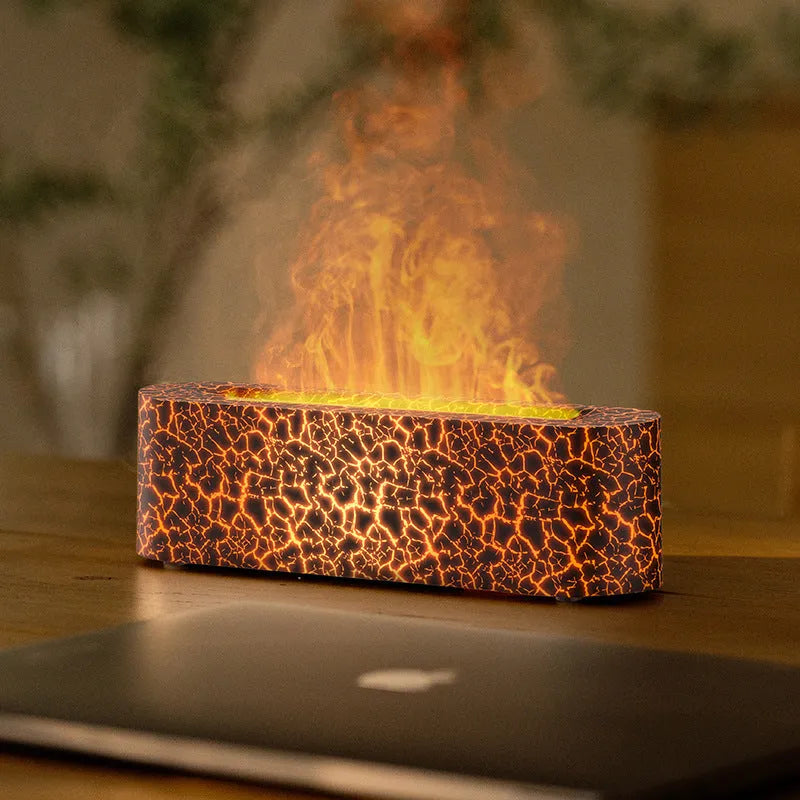 Square black creative lava flame USB desktop humidifier and essential oil diffuser on a desk.