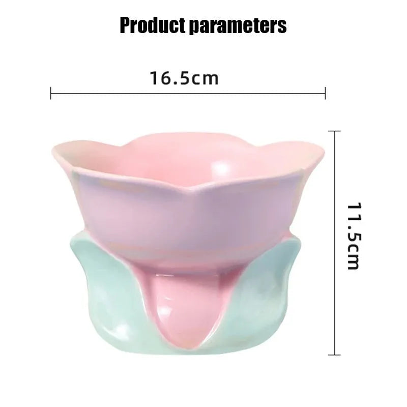 Pink floral patterned raised ceramic bowl for cat or small dog feeding on a non-slip base.