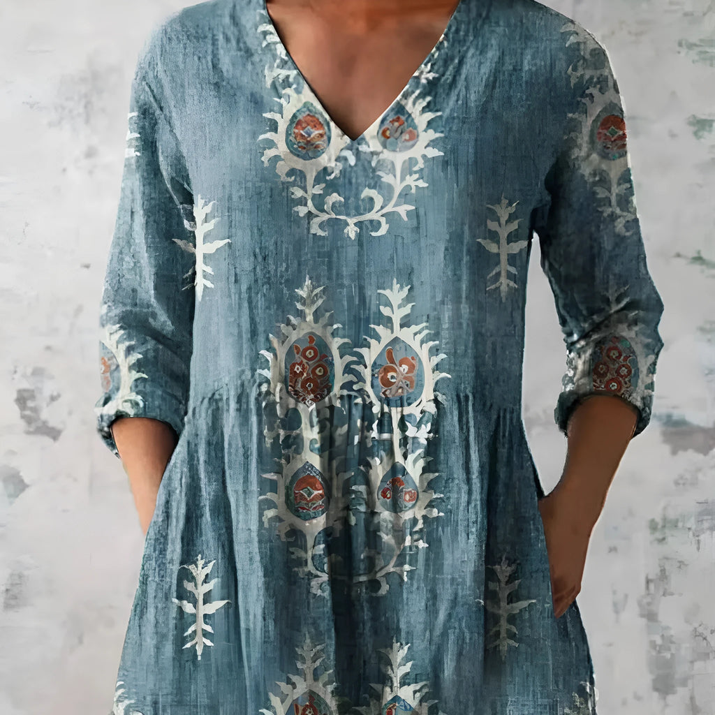 Women's printed wave pattern loose dress with wide waist and 3/4 length sleeves.