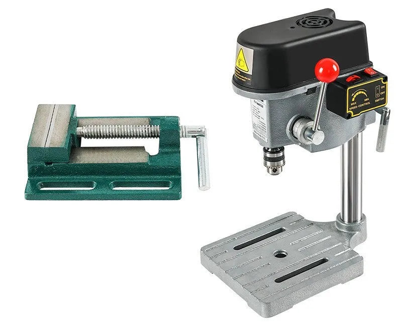 Mini bench drill and milling machine on a workbench with cross bench pliers and heavy-duty pliers.